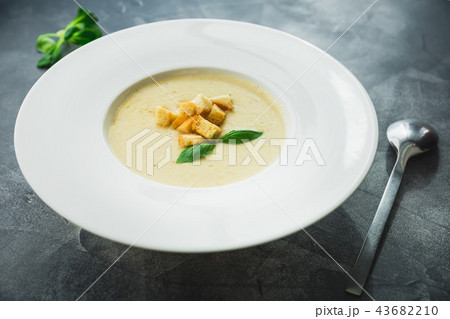 Homemade pea soup with grilled bread and leaf Homemade pea soup with grilled bread and leaf 43682210