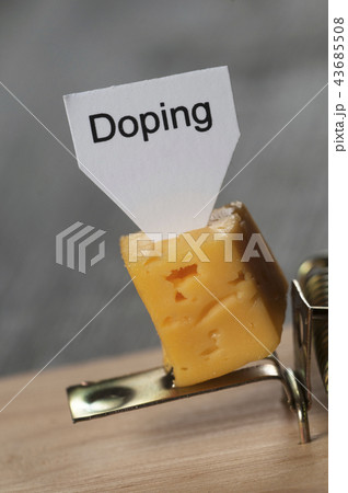Doping sign on a cheese in mouse trap 43685508