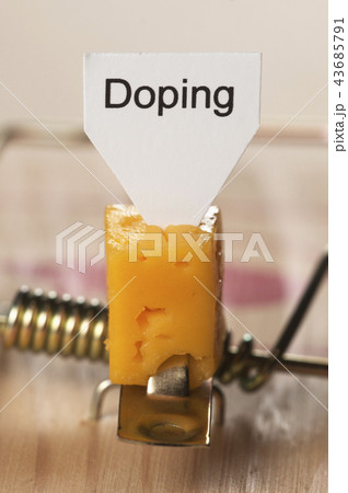 Doping sign on a cheese in mouse trap Doping sign on a cheese in mouse trap 43685791