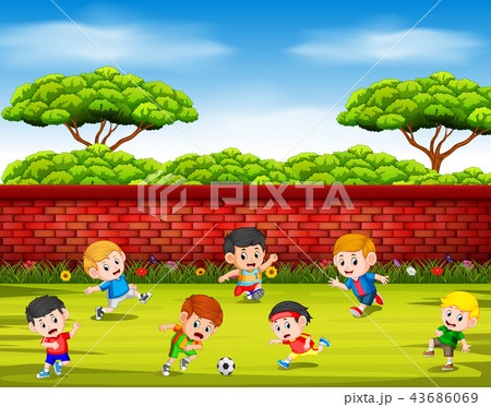 the children playing soccer with their team  the children playing soccer with their team  43686069