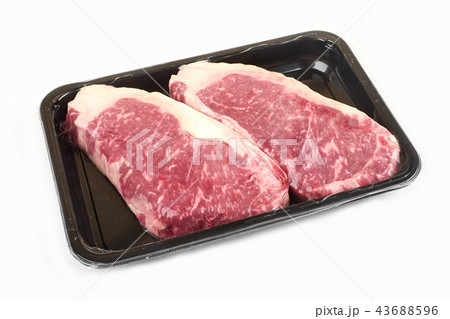 Raw steak in an airtight vacuum package on a white background. 43688596