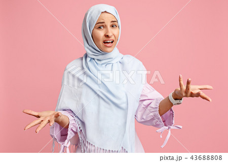 Argue, arguing concept. arab woman in hijab. Portrait of girl, posing at studio background 43688808