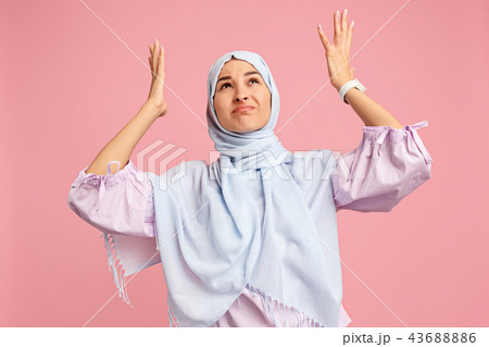 Argue, arguing concept. arab woman in hijab. Portrait of girl, posing at studio background 43688886