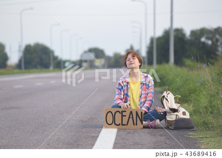 girl with a guitar hitch-hiking 43689416