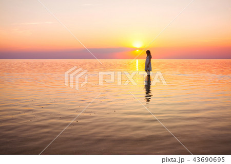 little girl looks at the sunset 43690695