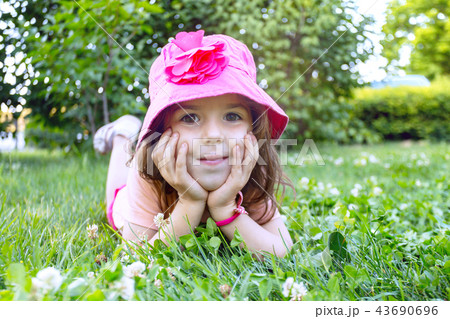 little girl on the lawn 43690696