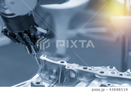 The robotic arm catch the steel plug 43696519