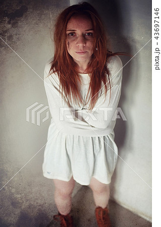 Young girl tied up on the floor. The abducted girl. The victim o 43697146