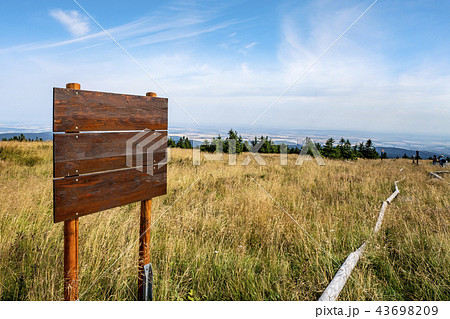 Wooden multi sign on the top of a hill Wooden multi sign on the top of a hill 43698209