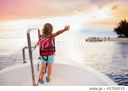 Kids sail on yacht in sea. Child sailing on boat. Kids sail on yacht in sea. Child sailing on boat. 43700535