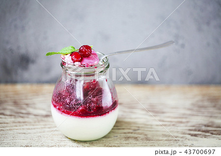 Vanilla panna cotta dessert with red berry Vanilla panna cotta dessert with red berry 43700697