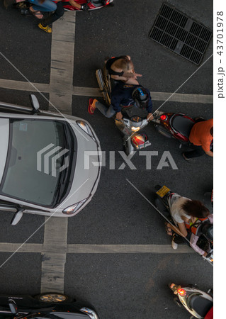 Car and Motorcycle at intersection with traffic Car and Motorcycle at intersection with traffic 43701978