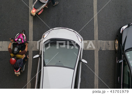 Car and Motorcycle at intersection with traffic Car and Motorcycle at intersection with traffic 43701979