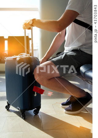 Passenger waiting for his flight at the airport 43703843