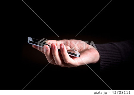 Person's hands using a smartphone 43708111