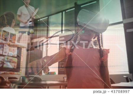 Composite image of girl wearing virtual reality simulator 43708997