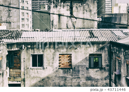 Worn building with shabby windows. Worn building with shabby windows. 43711446