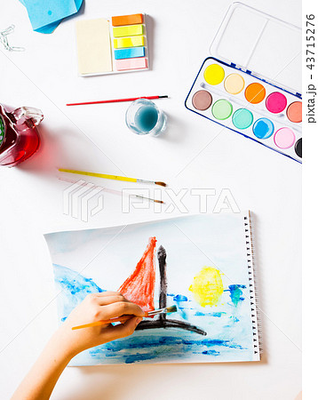 Boy making a painting of a boat 43715276
