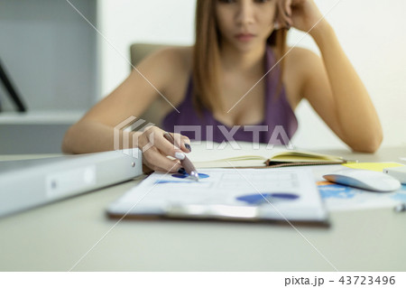 Beautiful young businesswoman working on business 43723496