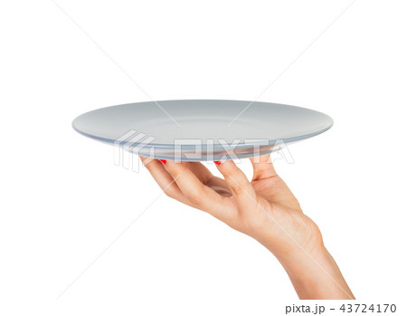 Blank empty round gray matte plate in female hand Blank empty round gray matte plate in female hand 43724170