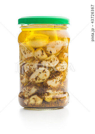 Pickled garlic in glass jar 43726367
