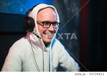technology, gaming, entertainment, let's play and people concept - happy young man in headset and 43726811