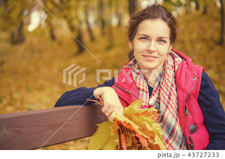 Portrait of young beautiful woman in autumn park Portrait of young beautiful woman in autumn park 43727233
