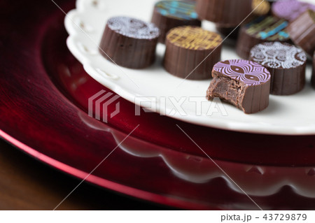 Artisan Fine Chocolate Candy On Serving Dish  43729879