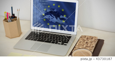 Composite image of laptop and various office accessories on table Composite image of laptop and various office accessories on table 43730187