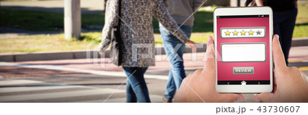 Composite image of cropped hands on businessman with digital tablet 43730607