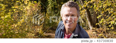 Composite image of close-up portrait of smiling man 43730830
