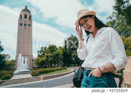 woman wearing stylishly and looking happily 43732624