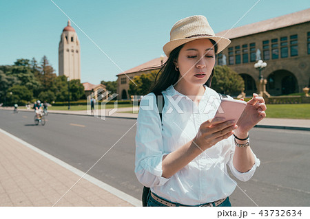 woman using phone and looking lost 43732634