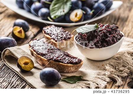 Breakfast from homemade plum jam and bread. 43736295