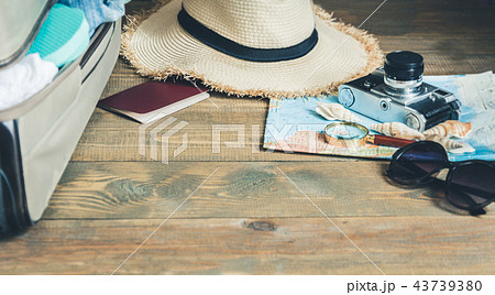 Open suitcase with female clothes on board.  43739380