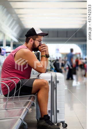 Man waiting on the train station Man waiting on the train station 43742033