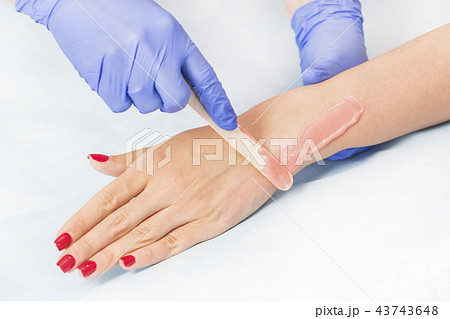 Process depilation female legs and hands in a beau 43743648
