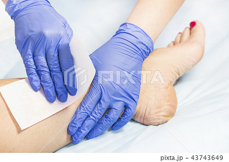 Process depilation female legs and hands in a beau 43743649