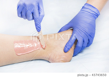 Process depilation female legs and hands in a beau 43743650