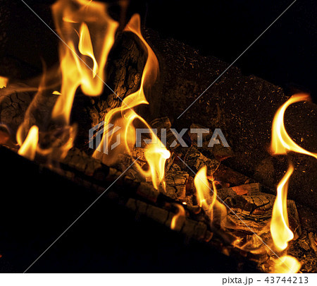burning logs in a fire at night burning logs in a fire at night 43744213