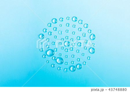 Circle of drops of water on a blue. Circle of drops of water on a blue. 43748880