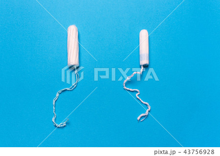 tampon on a blue background.  Concept  menstrua 43756928