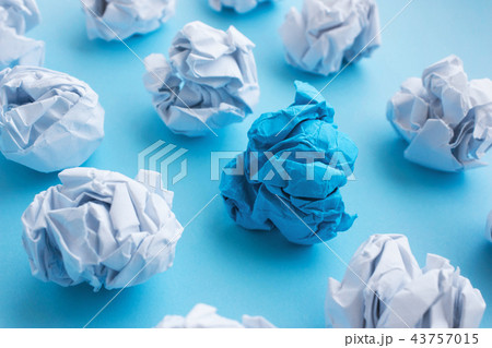 blue wrinkled ball of paper among the whites.  43757015