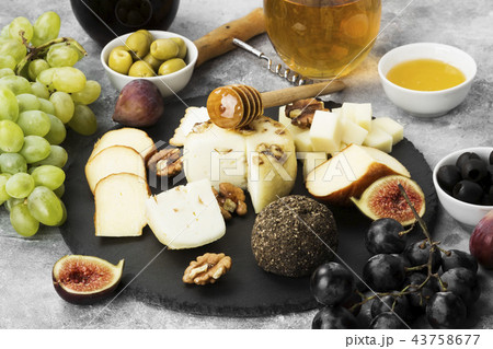 Snacks with wine - various types of cheeses, figs 43758677
