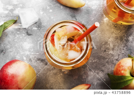 Peach ice tea on a gray background. Top view 43758896