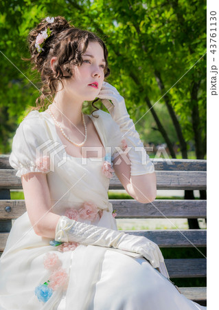 woman in bride dress with a book in their hands 43761130