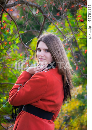 Young attractive woman in autumn day outdoors. 43761131