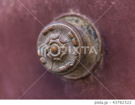 close up on a round door handle with decorative close up on a round door handle with decorative 43762322