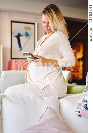 Pregnant woman at home Pregnant woman at home 43762841