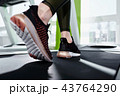 The legs of a girl on a treadmill close up 43764290